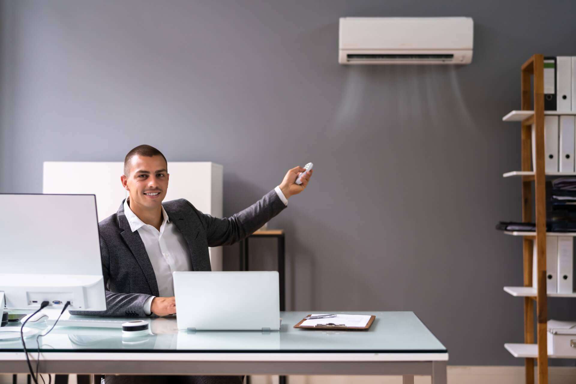 HVAC technician installing a mini split AC unit for a business in Baltimore