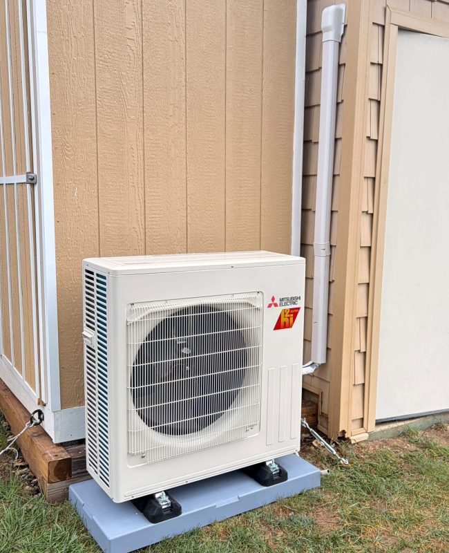Mitsubishi ductless heat pump outdoor unit on a pad in Catonsville, MD